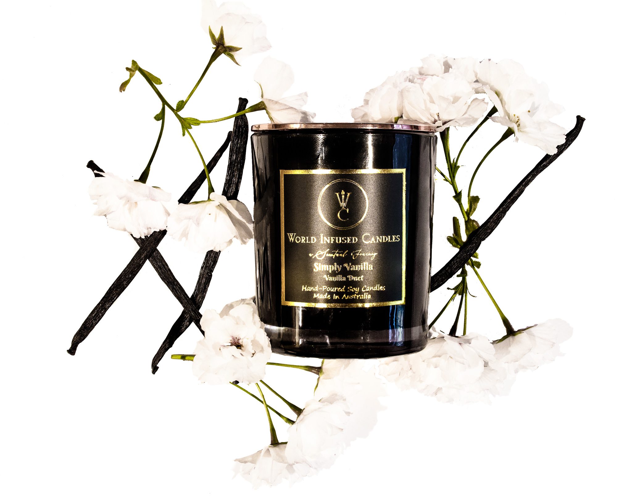 Simply Vanilla Soy Candle surrounded with Vanilla bean pods