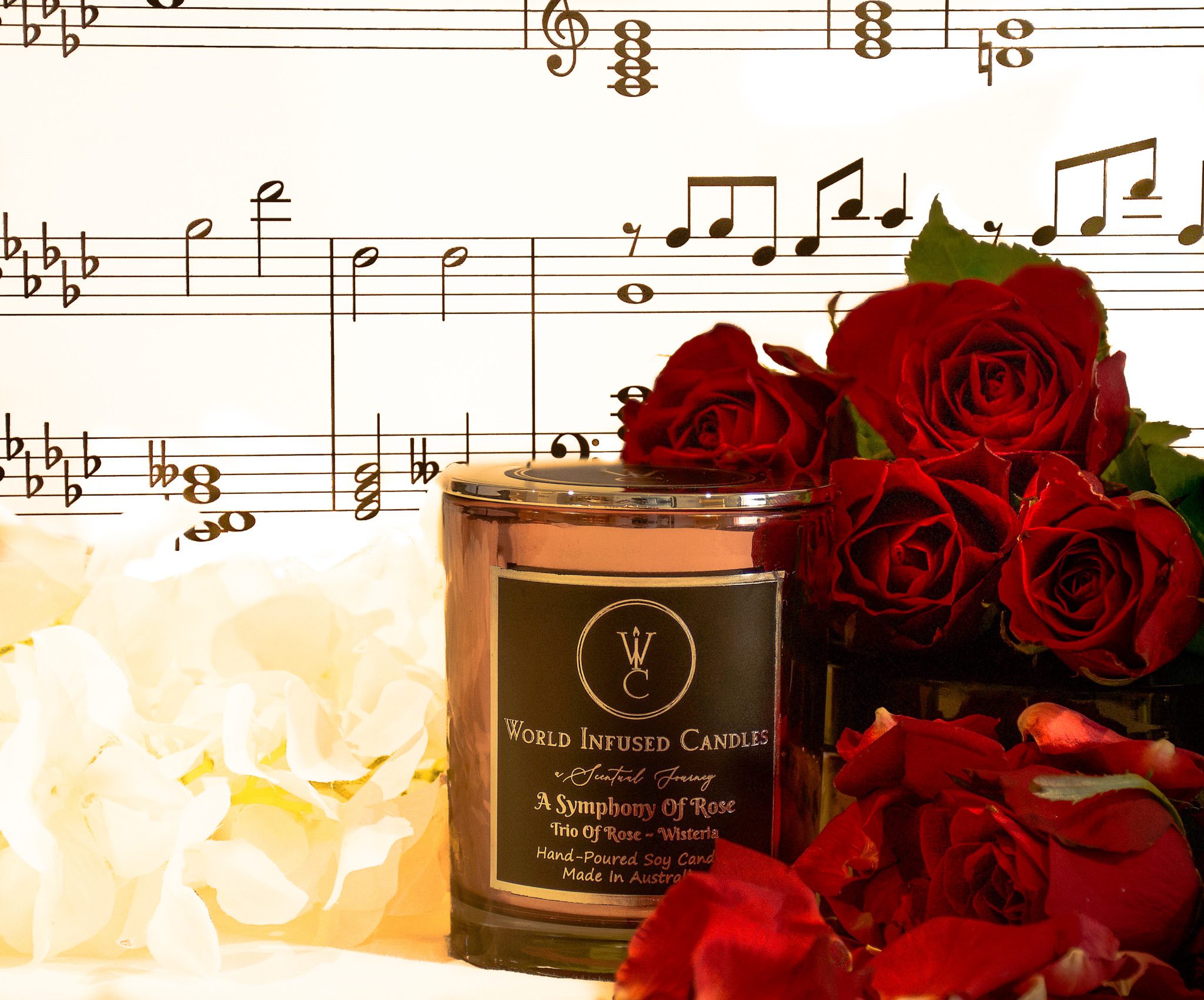 A Symphony Of Rose Soy Candle in the center surrounded by roses and music notes