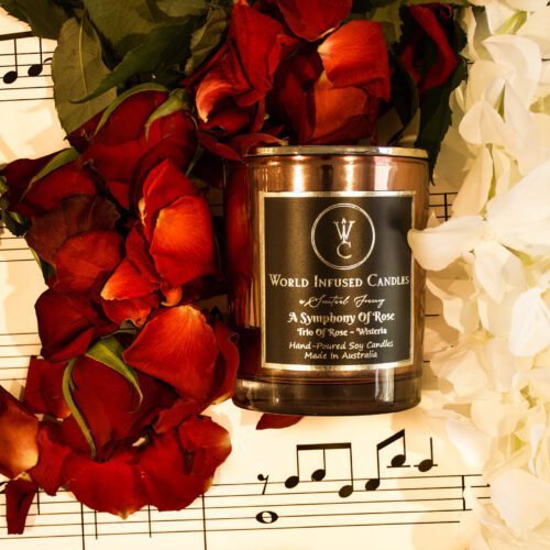Top down of A Symphony Of Rose Soy Candle with music notes and roses in the background