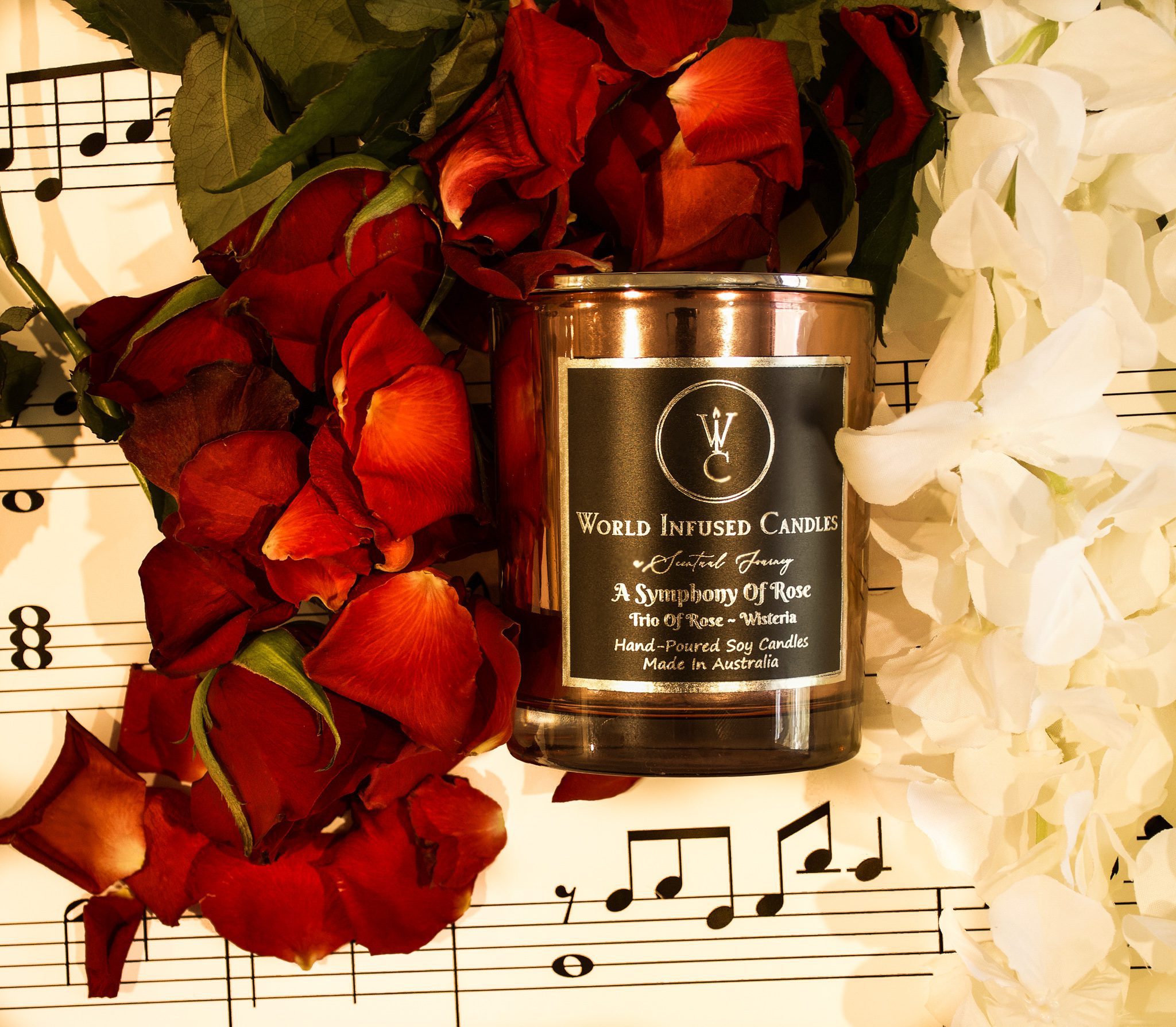 Top down of A Symphony Of Rose Soy Candle with music notes and roses in the background