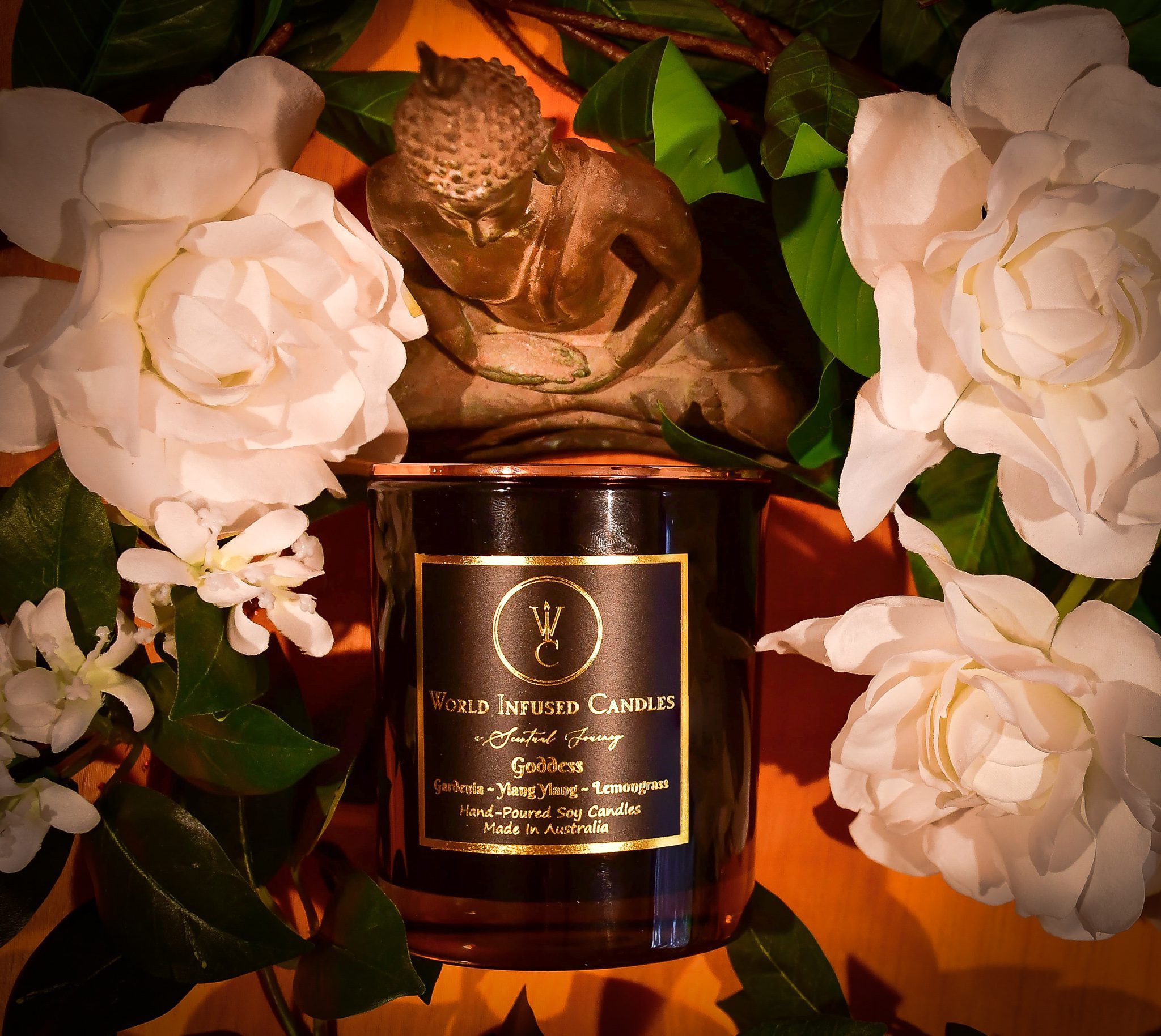 Goddess Candle top down in the center of Gardenia flowers