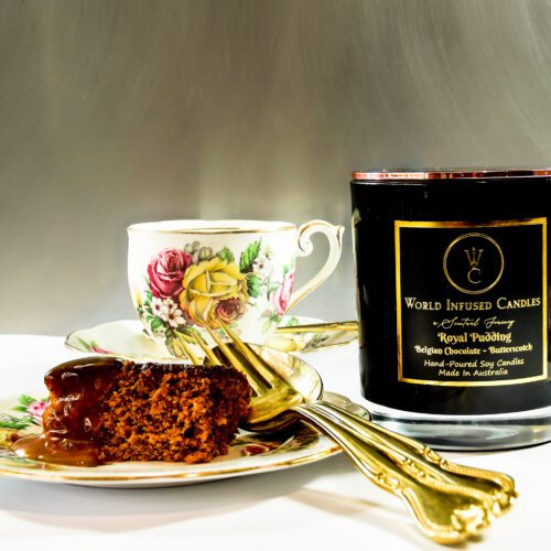 Royal Pudding chocolate and butterscotch candle wih tea in the background