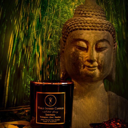 Sanctuary Lemongrass and Bamboo Candle is combined with Clove buddha statue in the background with bamboo